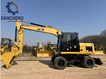 Ekskavator me goma CATERPILLAR M320