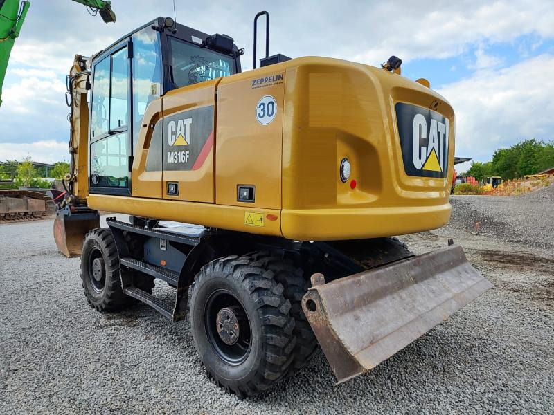 Caterpillar M316F - Ekskavator me goma: foto 1 Caterpillar M316F - Ekskavator me goma: foto 1