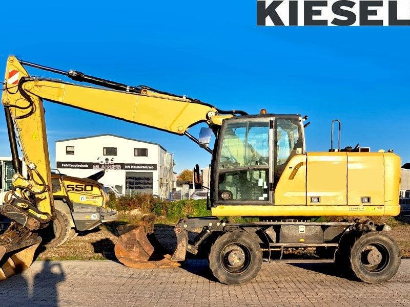 CAT M 318 F - Ekskavator me goma: foto 1 CAT M 318 F - Ekskavator me goma: foto 1