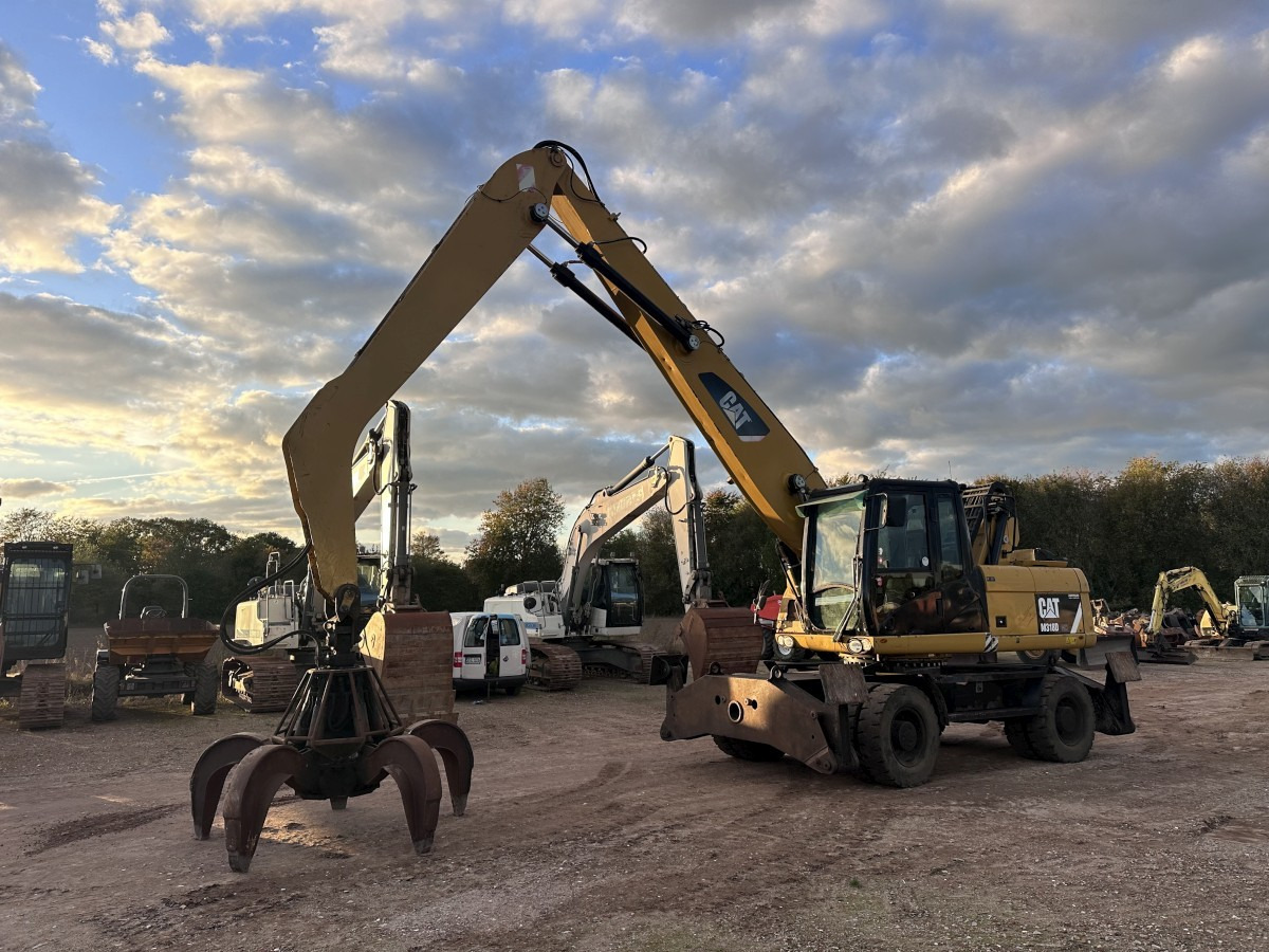 CATERPILLAR M 318 MH mit Greifer Kein 3022 3026 320 322 - Ekskavator me goma: foto 1 CATERPILLAR M 318 MH mit Greifer Kein 3022 3026 320 322 - Ekskavator me goma: foto 1