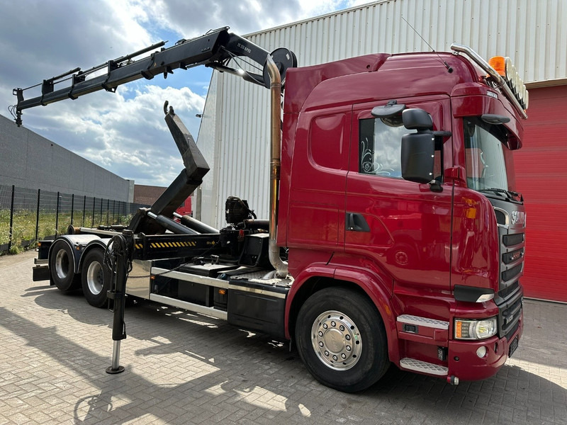 Scania R580 6X2 V8 HOOKLIFT + CRANE HIAB 211 E-4 HIPRO - ROTATOR - RETARDER - RADIO - NL TRUCK - Kamion vetëngarkues, Kamion me vinç: foto 1 Scania R580 6X2 V8 HOOKLIFT + CRANE HIAB 211 E-4 HIPRO - ROTATOR - RETARDER - RADIO - NL TRUCK - Kamion vetëngarkues, Kamion me vinç: foto 1