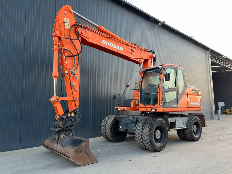 Doosan DX170W - Ekskavator me goma: foto 1 Doosan DX170W - Ekskavator me goma: foto 1