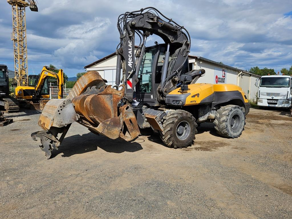 MECALAC 12 MXT - Ekskavator me goma: foto 1 MECALAC 12 MXT - Ekskavator me goma: foto 1