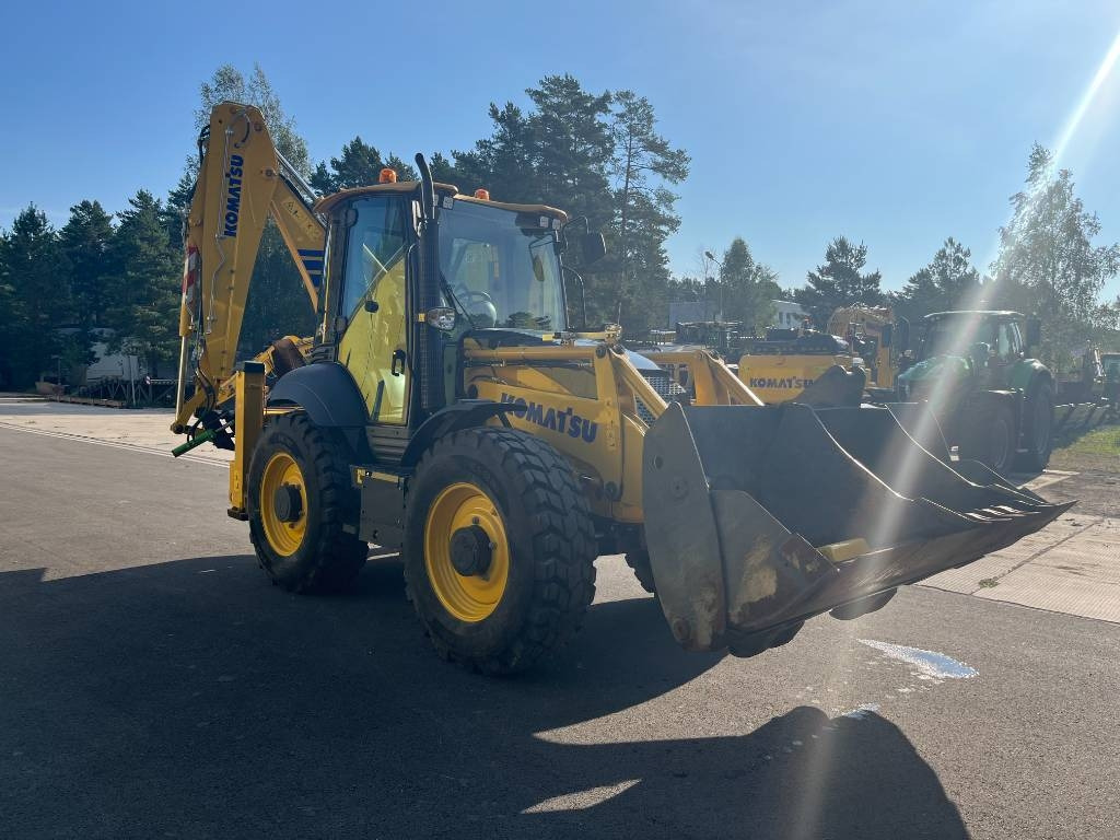 Komatsu WB 97 S-8 - Fadromë me shkarkim nga prapa: foto 4 Komatsu WB 97 S-8 - Fadromë me shkarkim nga prapa: foto 4