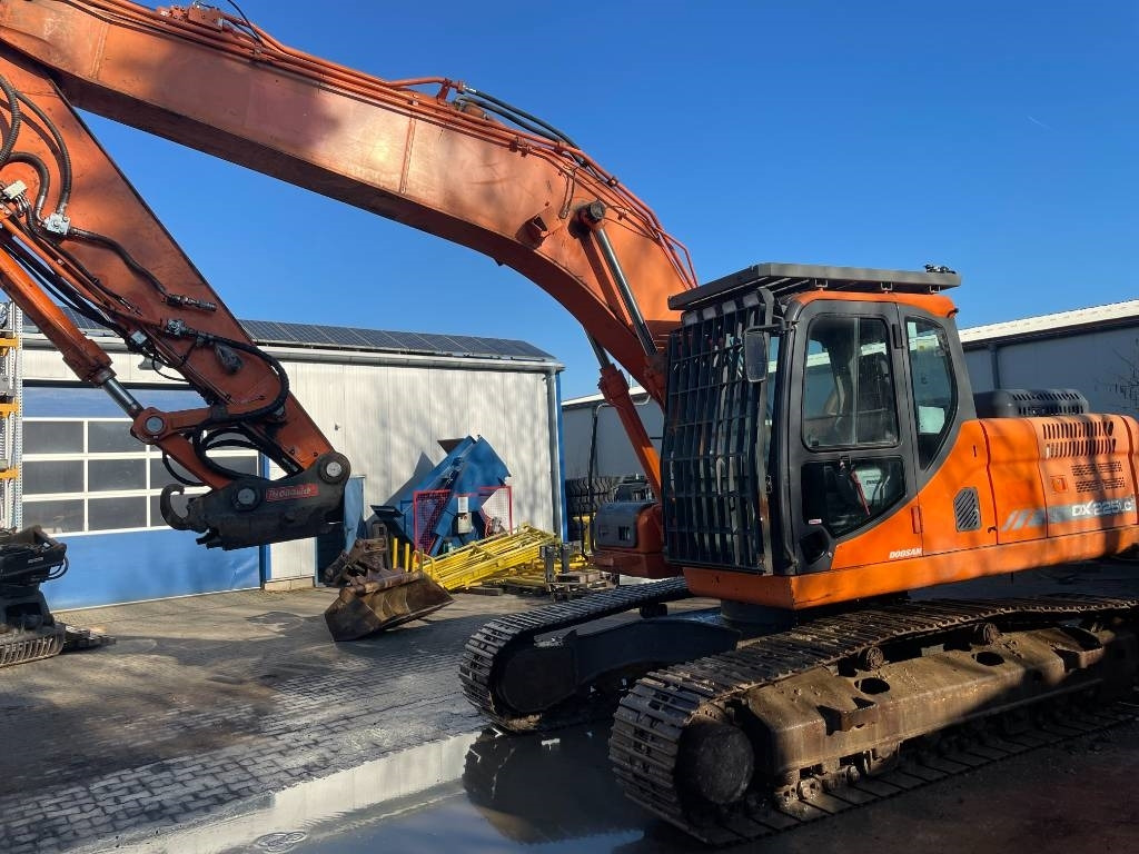 Doosan EXCA - Ekskavator me zinxhirë: foto 4 Doosan EXCA - Ekskavator me zinxhirë: foto 4
