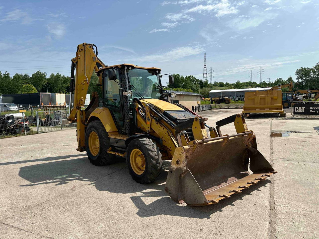 CAT 432F2 - Fadromë me shkarkim nga prapa: foto 2 CAT 432F2 - Fadromë me shkarkim nga prapa: foto 2