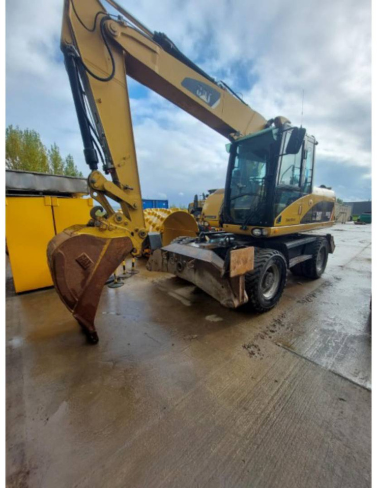 CAT M315D - Ekskavator me goma: foto 1 CAT M315D - Ekskavator me goma: foto 1