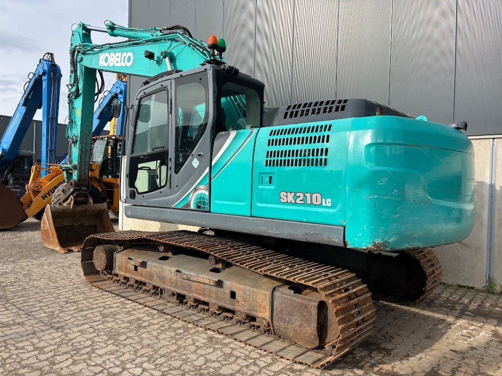 Kobelco SK 210 LC-10 - SK210 - SK 210 - Ekskavator me zinxhirë: foto 3 Kobelco SK 210 LC-10 - SK210 - SK 210 - Ekskavator me zinxhirë: foto 3