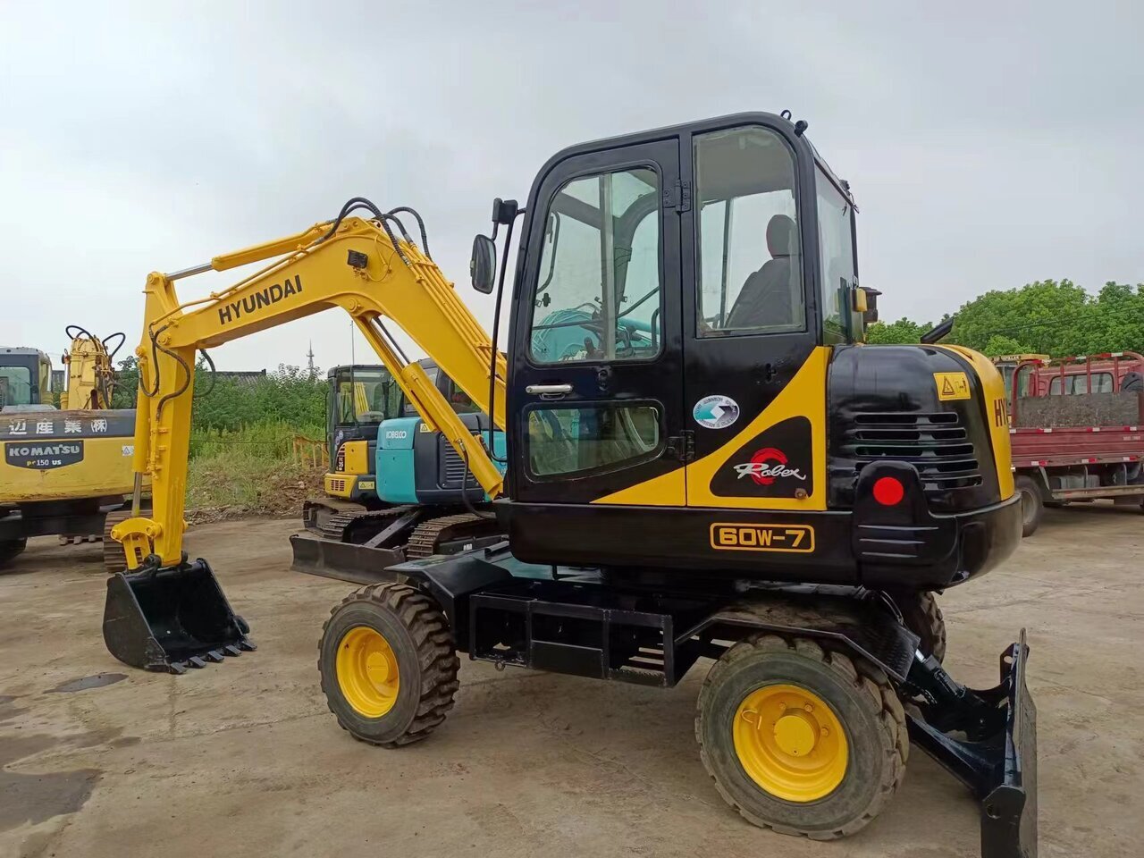 HYUNDAI 60W-7 - Ekskavator me goma: foto 1 HYUNDAI 60W-7 - Ekskavator me goma: foto 1