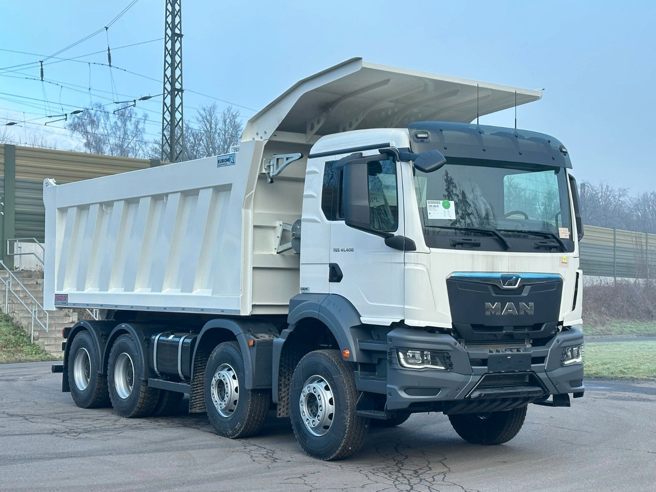 MAN TGS 41.400 8x4 / EUROMIX MTP 23m³/ Eckige Mulde MAN TGS 41.400 8x4 / EUROMIX MTP 23m³/ Eckige Mulde - Kamion vetëshkarkues: foto 4 MAN TGS 41.400 8x4 / EUROMIX MTP 23m³/ Eckige Mulde MAN TGS 41.400 8x4 / EUROMIX MTP 23m³/ Eckige Mulde - Kamion vetëshkarkues: foto 4