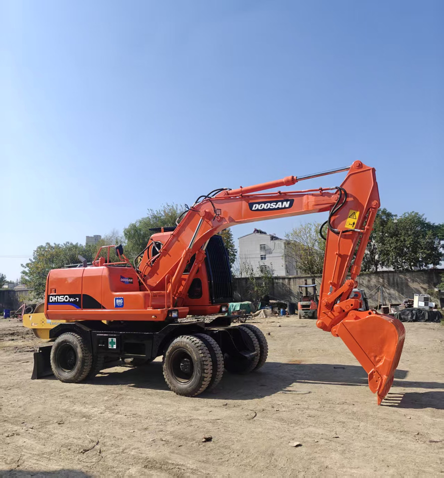Doosan DH150W - Ekskavator me goma: foto 1 Doosan DH150W - Ekskavator me goma: foto 1