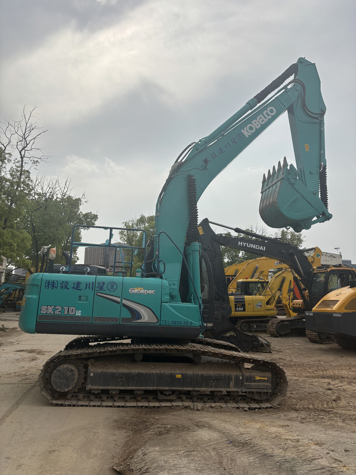 KOBELCO SK210LC - Ekskavator me zinxhirë: foto 4 KOBELCO SK210LC - Ekskavator me zinxhirë: foto 4