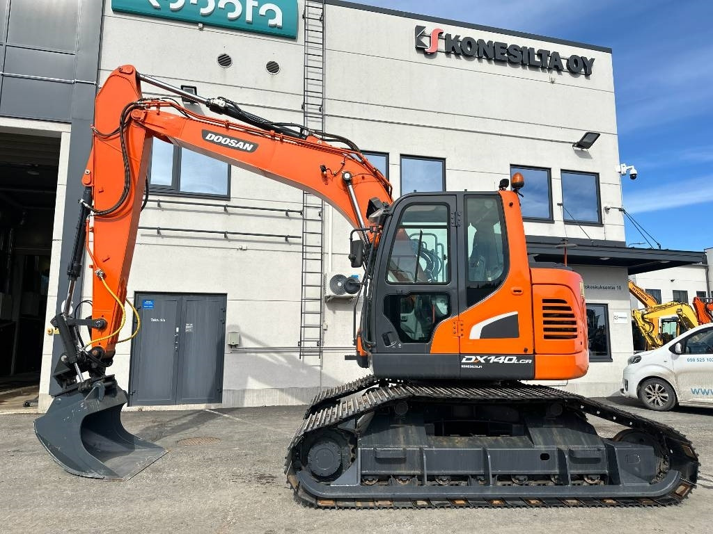 Doosan DX 140 LCR-5 metsäalusta - Ekskavator me zinxhirë: foto 1 Doosan DX 140 LCR-5 metsäalusta - Ekskavator me zinxhirë: foto 1