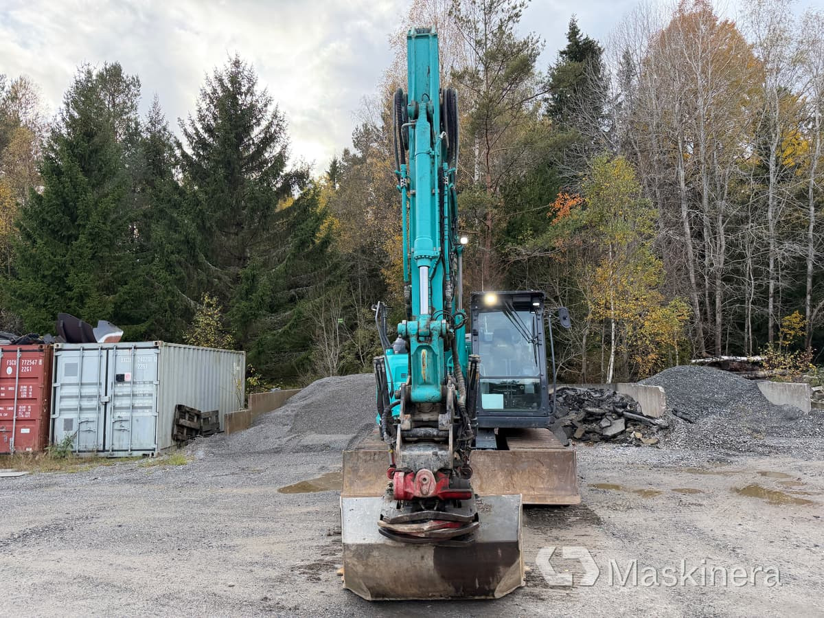 Grävmaskin Kobelco SK140SRLC-7 - Ekskavator me zinxhirë: foto 2 Grävmaskin Kobelco SK140SRLC-7 - Ekskavator me zinxhirë: foto 2