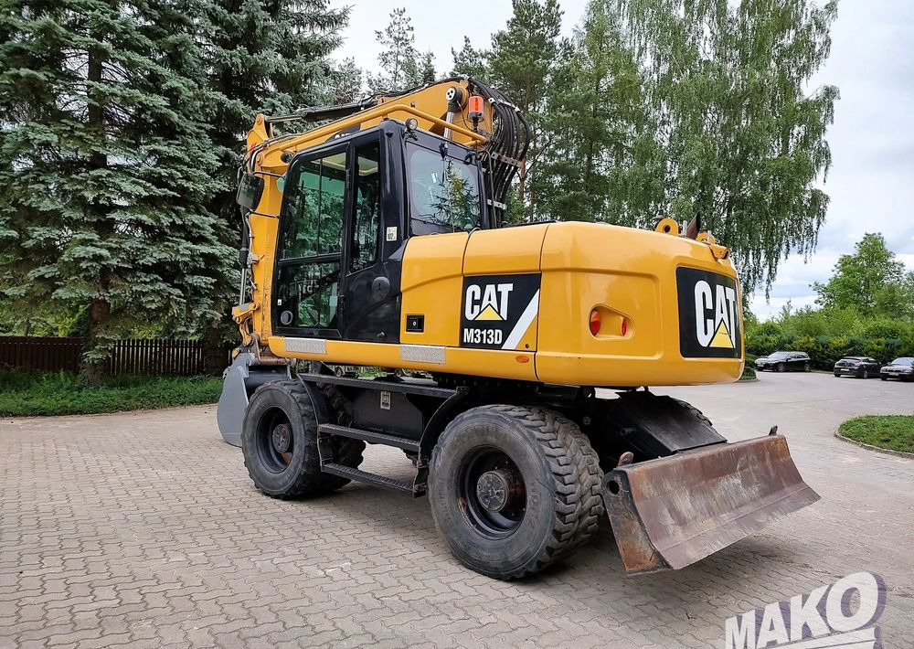 Caterpillar M313D - Ekskavator me goma: foto 2 Caterpillar M313D - Ekskavator me goma: foto 2