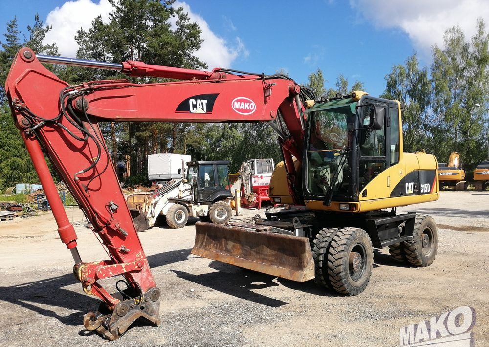 Caterpillar M315 C - Ekskavator me goma: foto 1 Caterpillar M315 C - Ekskavator me goma: foto 1