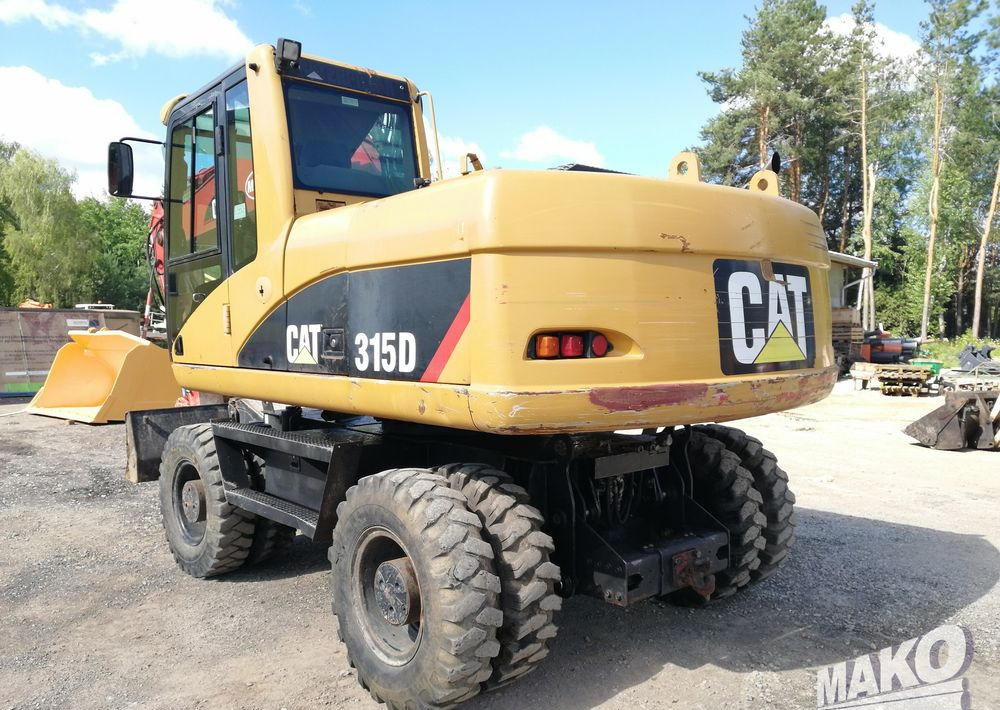 Caterpillar M315 C - Ekskavator me goma: foto 3 Caterpillar M315 C - Ekskavator me goma: foto 3
