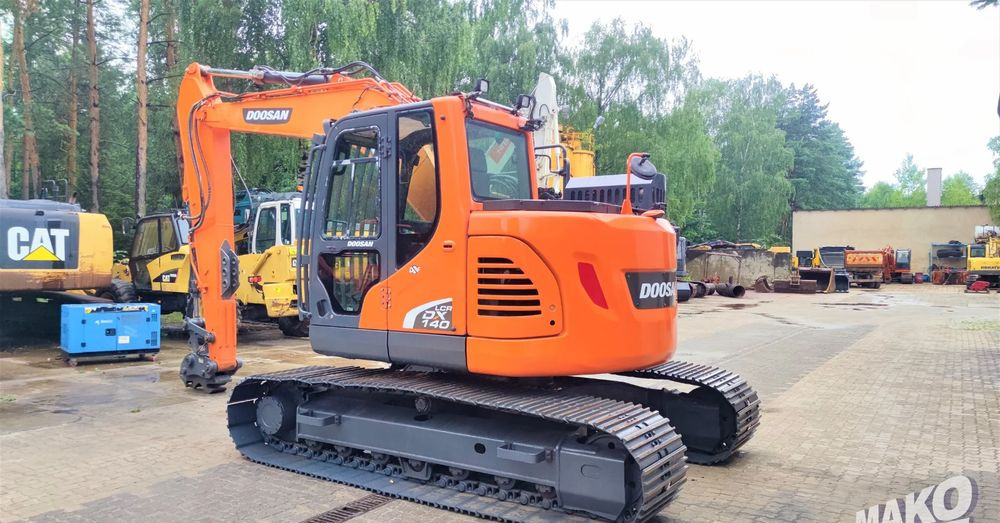 Doosan DX140LCR-5 - Ekskavator me zinxhirë: foto 2 Doosan DX140LCR-5 - Ekskavator me zinxhirë: foto 2