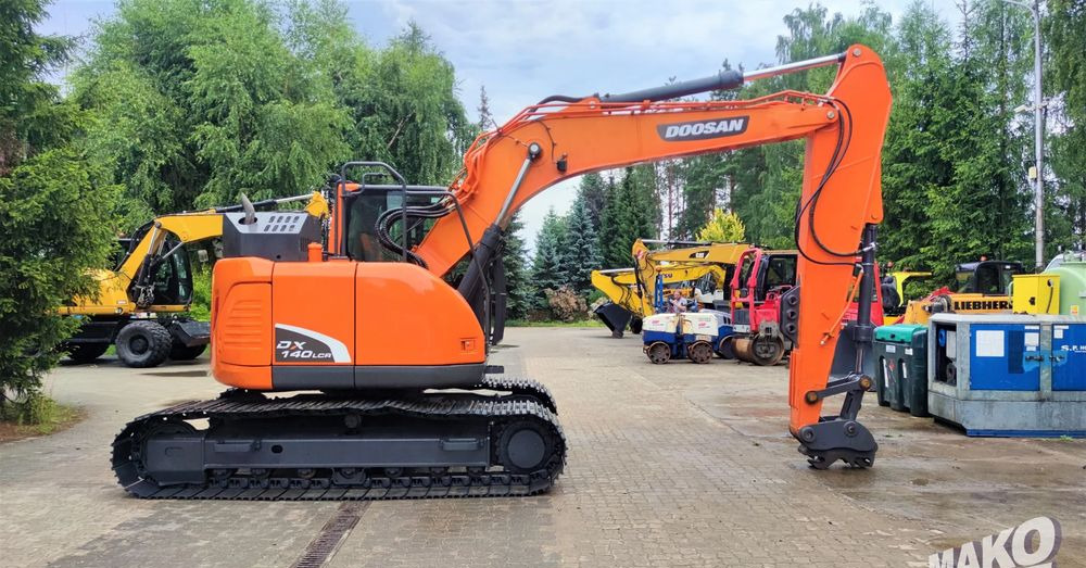 Doosan DX140LCR-5 - Ekskavator me zinxhirë: foto 5 Doosan DX140LCR-5 - Ekskavator me zinxhirë: foto 5
