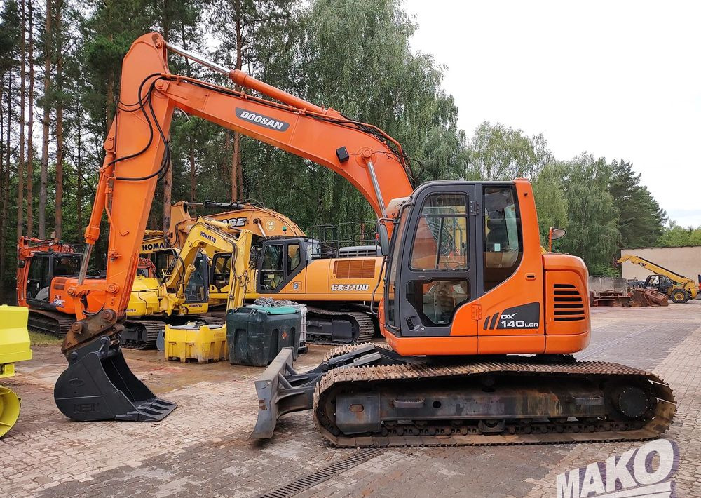 Doosan DX140LCR - Ekskavator me zinxhirë: foto 1 Doosan DX140LCR - Ekskavator me zinxhirë: foto 1