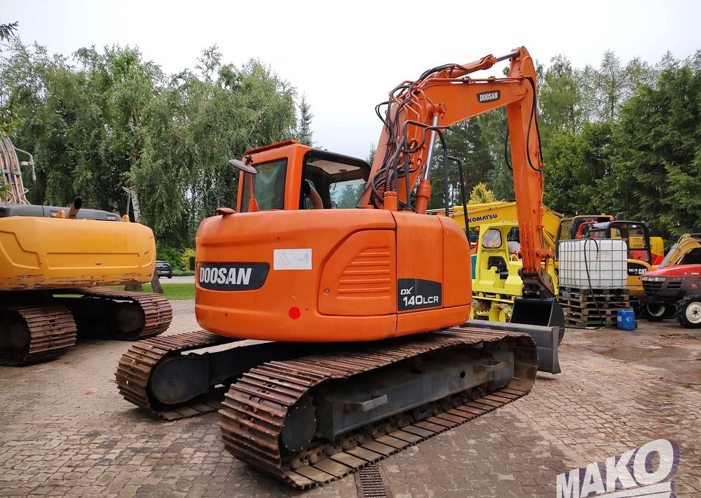 Doosan DX140LCR - Ekskavator me zinxhirë: foto 4 Doosan DX140LCR - Ekskavator me zinxhirë: foto 4