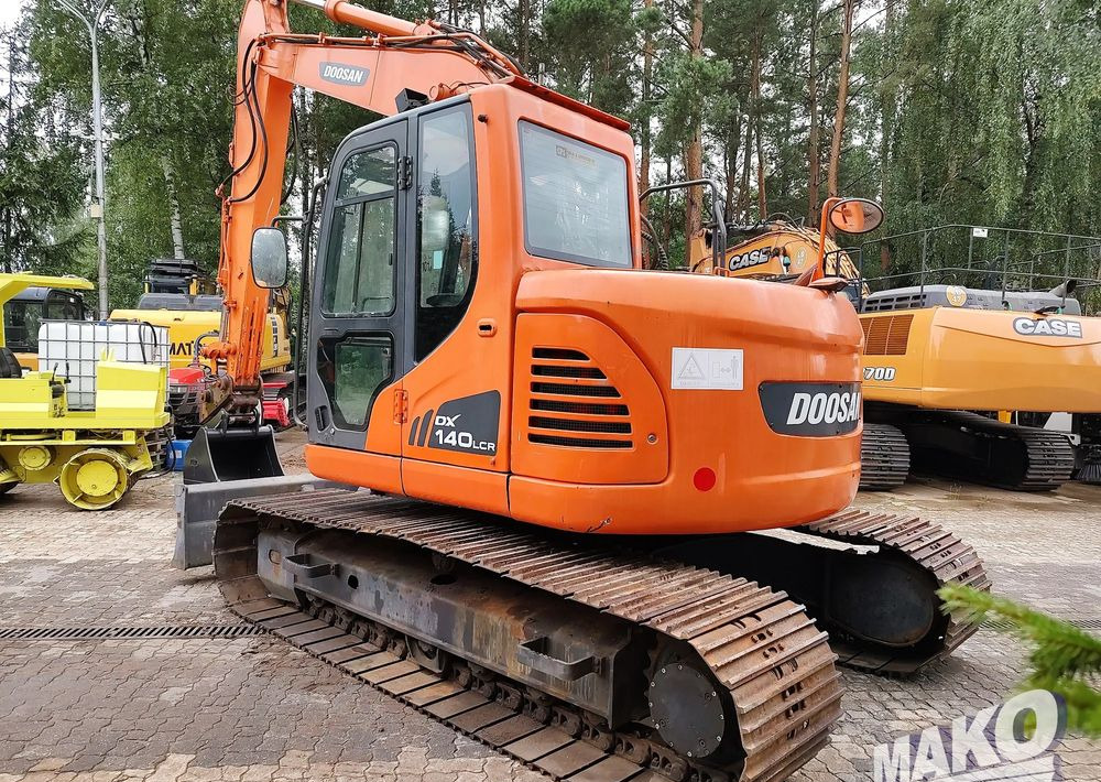 Doosan DX140LCR - Ekskavator me zinxhirë: foto 2 Doosan DX140LCR - Ekskavator me zinxhirë: foto 2