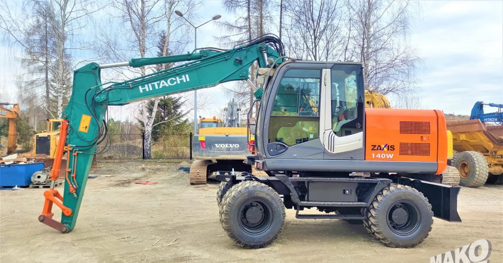 Hitachi ZX140W-3 - Ekskavator me goma: foto 1 Hitachi ZX140W-3 - Ekskavator me goma: foto 1