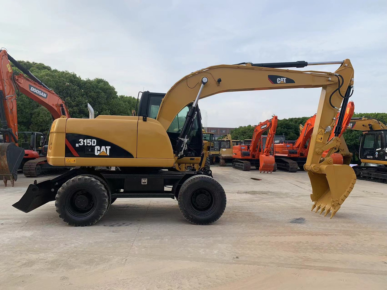 Caterpillar M315D Wheel Excavator Moving by Tires - Ekskavator me goma: foto 1 Caterpillar M315D Wheel Excavator Moving by Tires - Ekskavator me goma: foto 1
