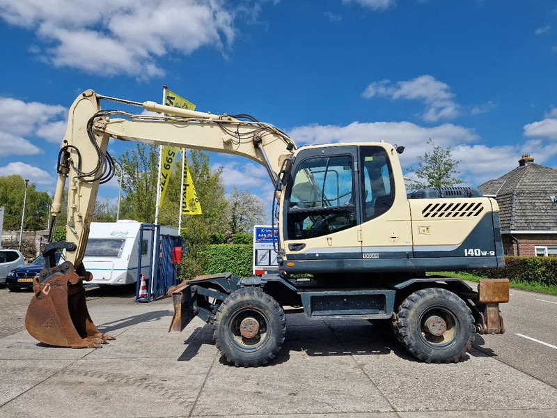 Hyundai Robex 140W-9 met airco - Ekskavator me goma: foto 1 Hyundai Robex 140W-9 met airco - Ekskavator me goma: foto 1