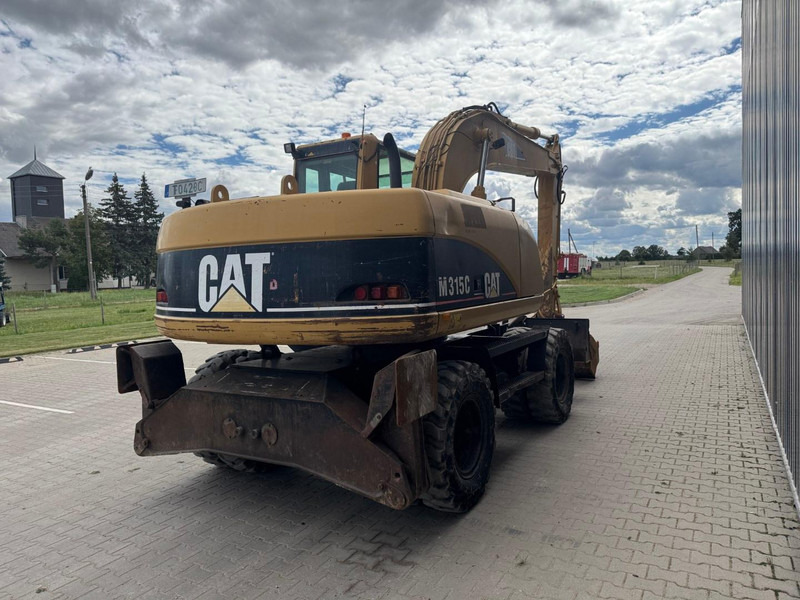 Caterpillar M 315 C - Ekskavator me goma: foto 3 Caterpillar M 315 C - Ekskavator me goma: foto 3