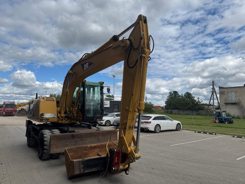 Caterpillar M 315 C - Ekskavator me goma: foto 2 Caterpillar M 315 C - Ekskavator me goma: foto 2