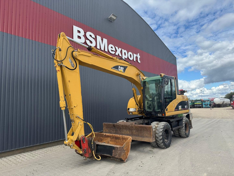 Caterpillar M 315 C - Ekskavator me goma: foto 1 Caterpillar M 315 C - Ekskavator me goma: foto 1