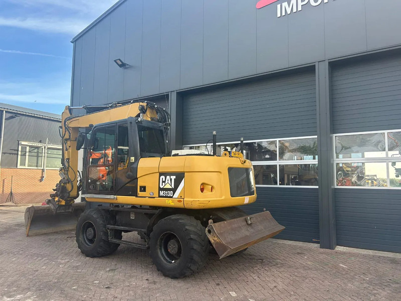 Caterpillar M313D - Ekskavator me goma: foto 2 Caterpillar M313D - Ekskavator me goma: foto 2