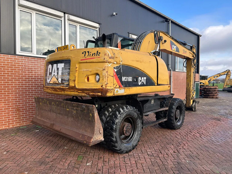 Caterpillar M316D - Ekskavator me goma: foto 2 Caterpillar M316D - Ekskavator me goma: foto 2