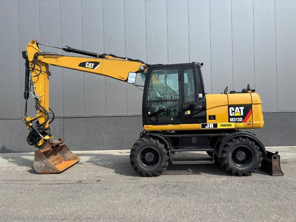 CAT M 313 D  - Ekskavator me goma: foto 1 CAT M 313 D  - Ekskavator me goma: foto 1