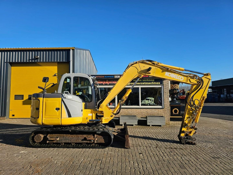 New Holland E80 - Ekskavator me zinxhirë: foto 5 New Holland E80 - Ekskavator me zinxhirë: foto 5