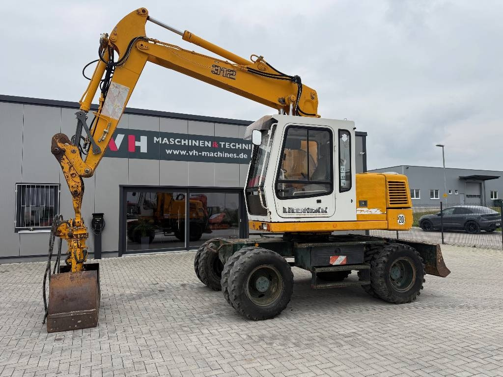 Liebherr A 312 - Ekskavator me goma: foto 1 Liebherr A 312 - Ekskavator me goma: foto 1