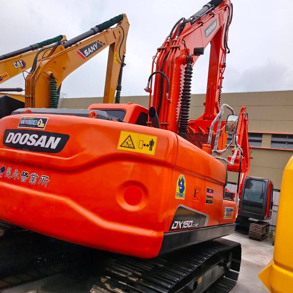 Doosan DX 150 LC - Ekskavator me zinxhirë: foto 2 Doosan DX 150 LC - Ekskavator me zinxhirë: foto 2