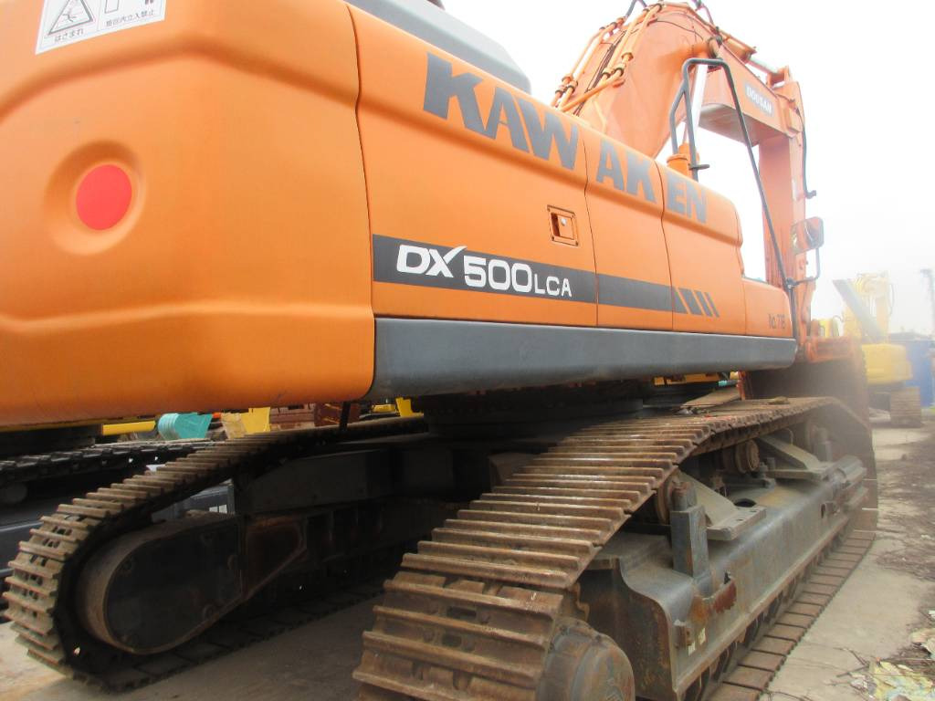 Doosan DX 500 LCA - Ekskavator me zinxhirë: foto 2 Doosan DX 500 LCA - Ekskavator me zinxhirë: foto 2
