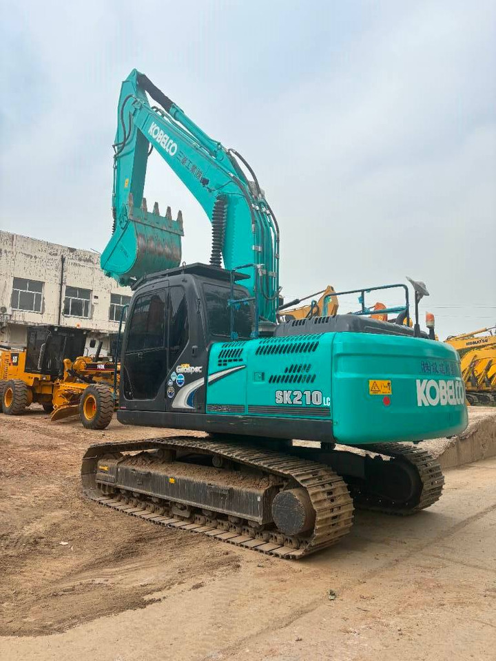 Kobelco SK 210 - Ekskavator me zinxhirë: foto 1 Kobelco SK 210 - Ekskavator me zinxhirë: foto 1