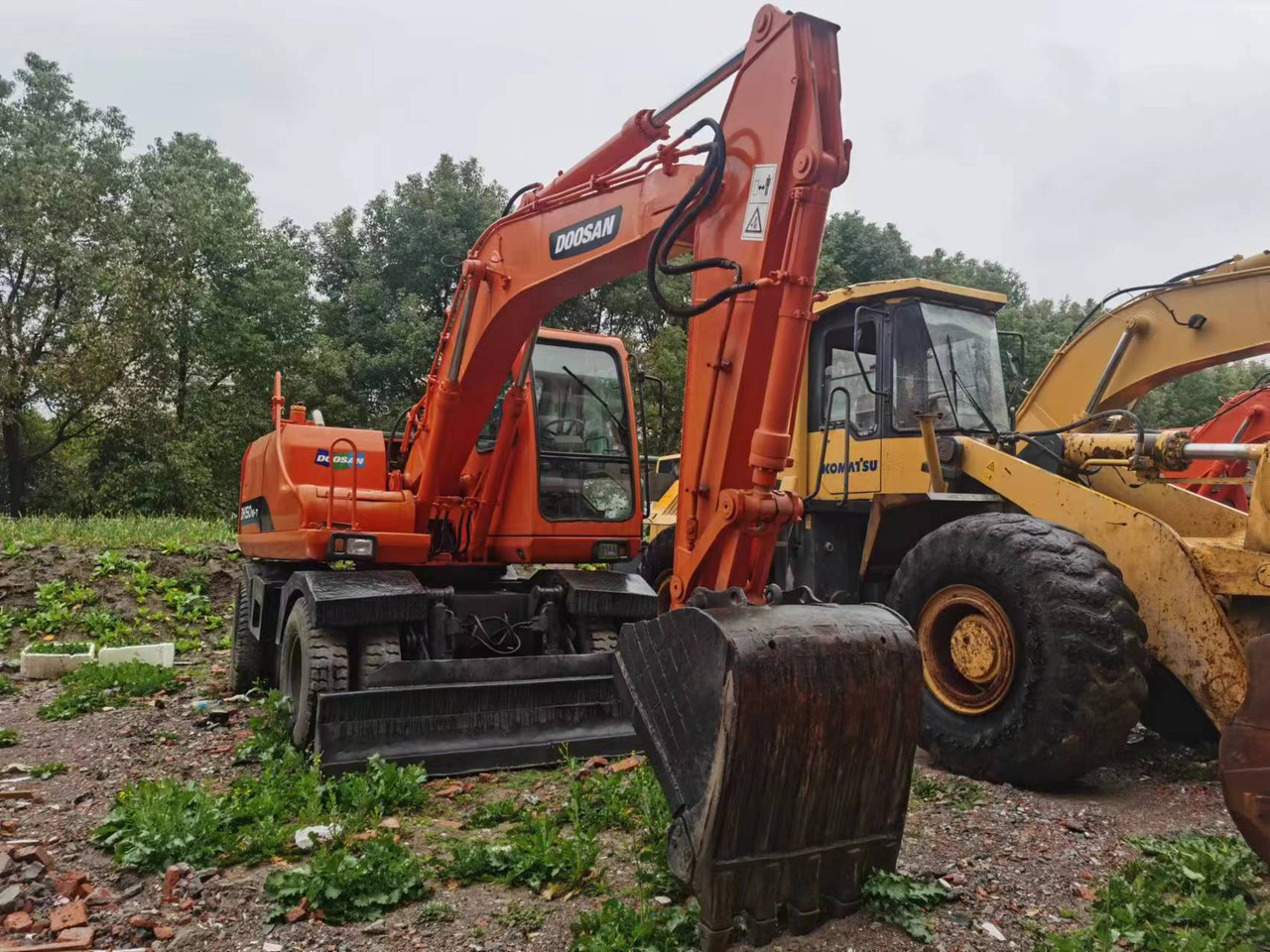 DOOSAN DH150W-7 - Ekskavator me goma: foto 1 DOOSAN DH150W-7 - Ekskavator me goma: foto 1