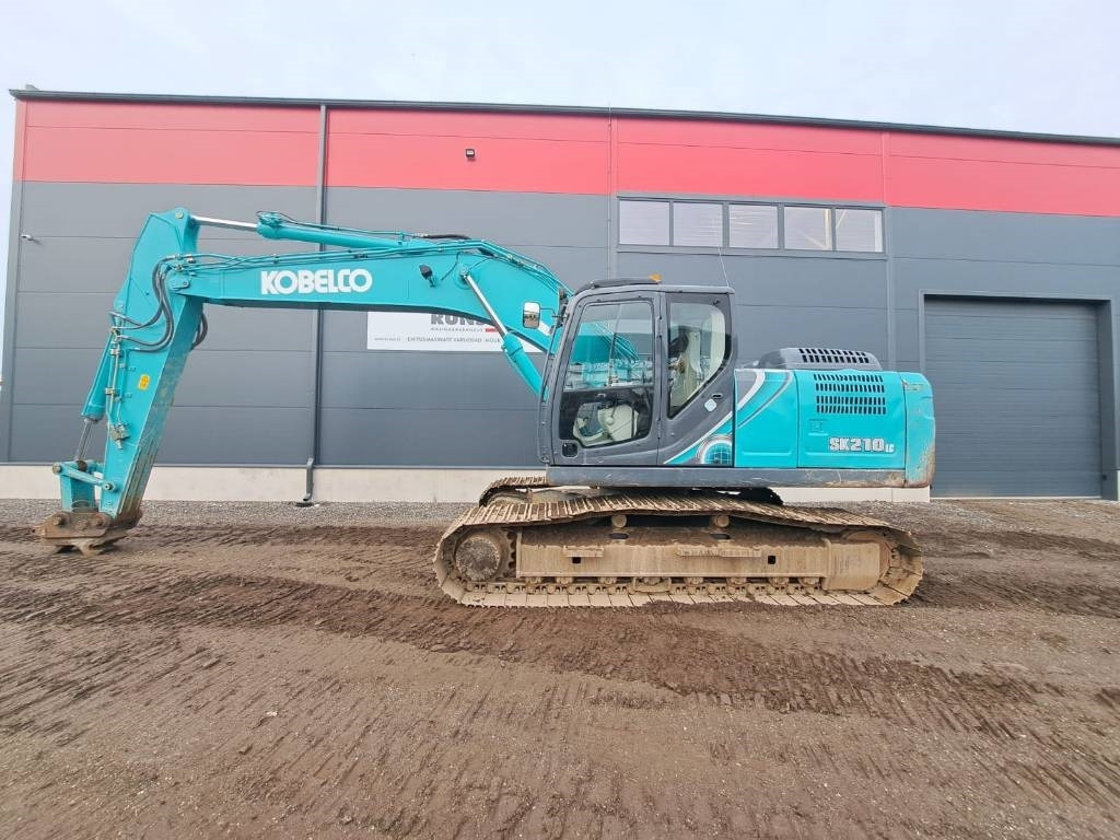 Kobelco SK 210-10 - Ekskavator me zinxhirë: foto 2 Kobelco SK 210-10 - Ekskavator me zinxhirë: foto 2