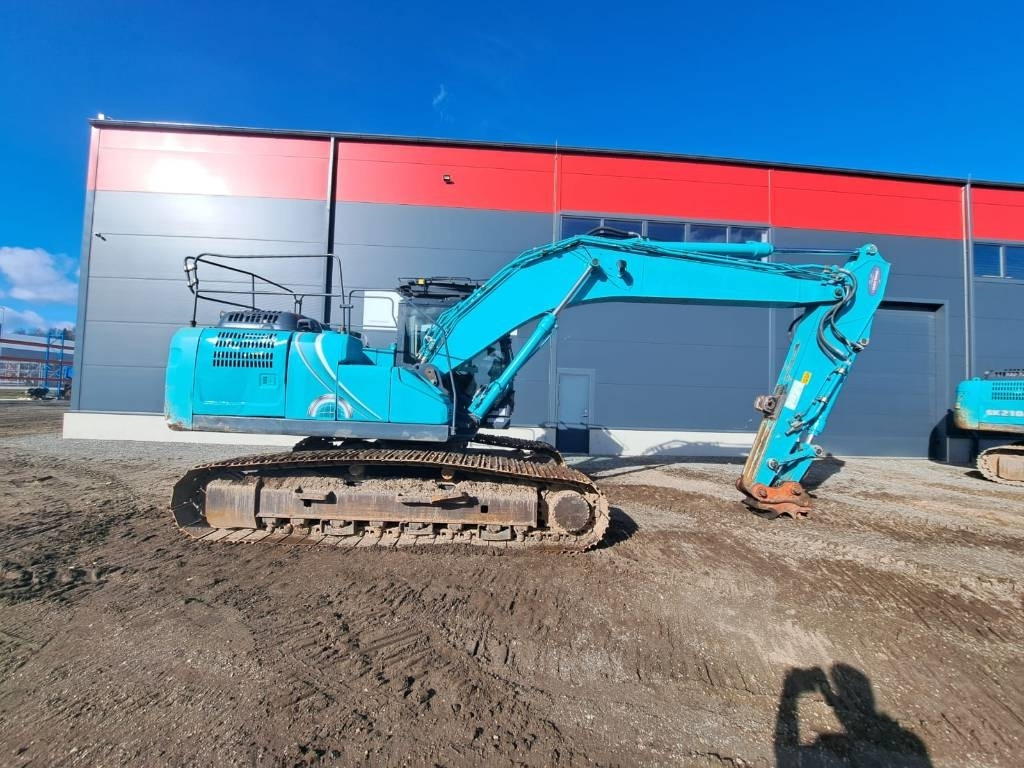 Kobelco SK 210-10 - Ekskavator me zinxhirë: foto 5 Kobelco SK 210-10 - Ekskavator me zinxhirë: foto 5