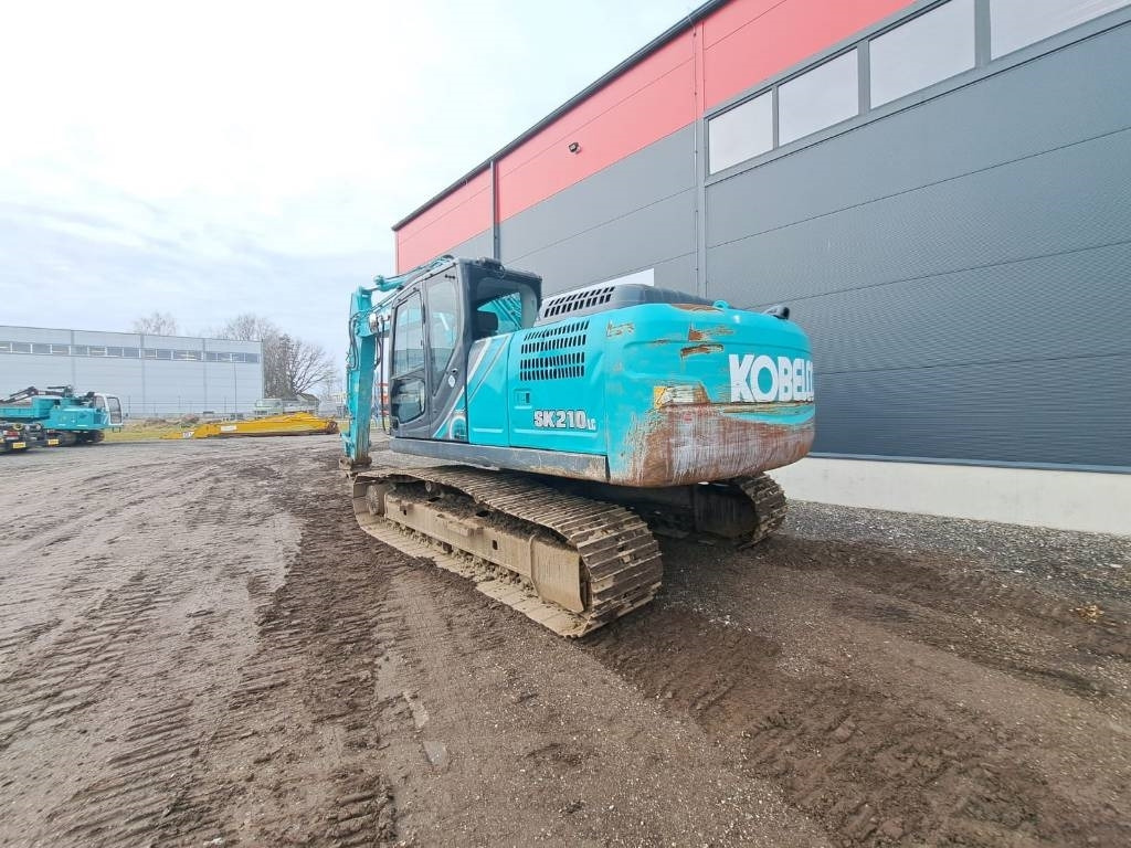 Kobelco SK 210-10 - Ekskavator me zinxhirë: foto 3 Kobelco SK 210-10 - Ekskavator me zinxhirë: foto 3