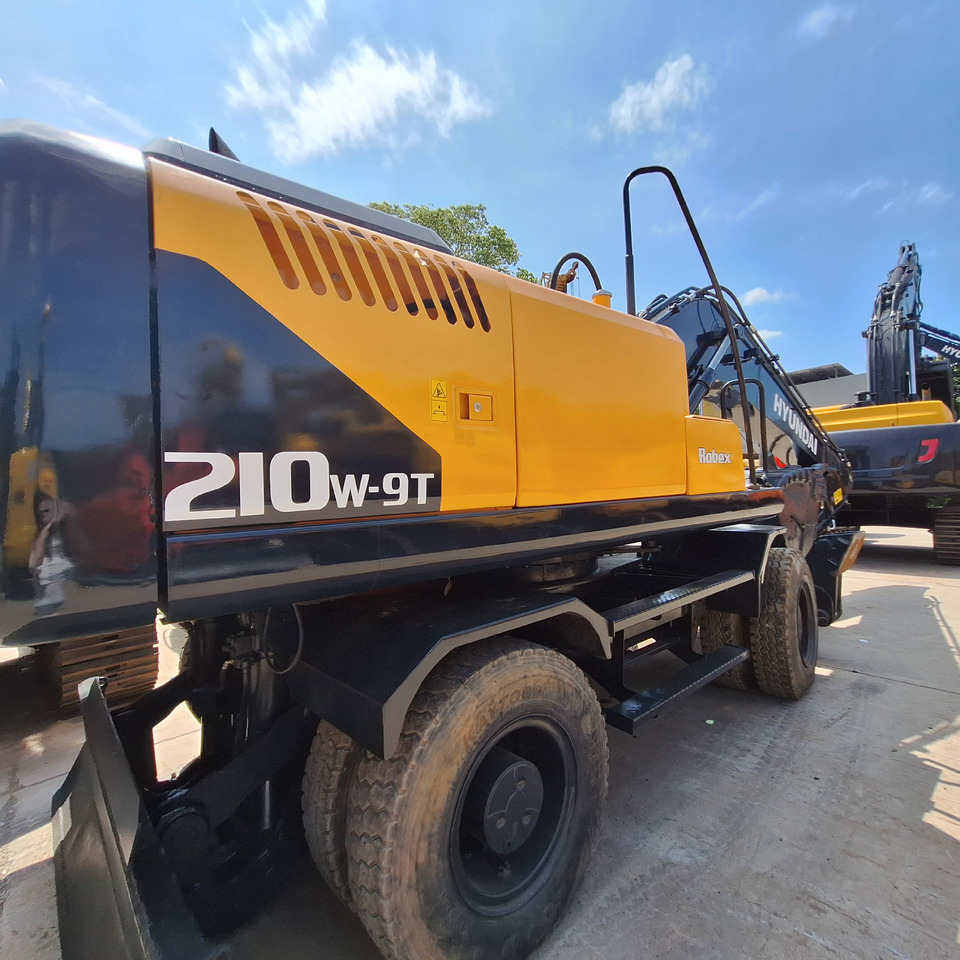 Hyundai 210w-9T wheel excavator - Ekskavator me goma: foto 1 Hyundai 210w-9T wheel excavator - Ekskavator me goma: foto 1
