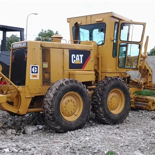Used Cheap Japan Cat 140G Grader Caterpillar 14g 140k 140h 140g 12g 120h Motor Grader - Makinë niveluese: foto 1 Used Cheap Japan Cat 140G Grader Caterpillar 14g 140k 140h 140g 12g 120h Motor Grader - Makinë niveluese: foto 1