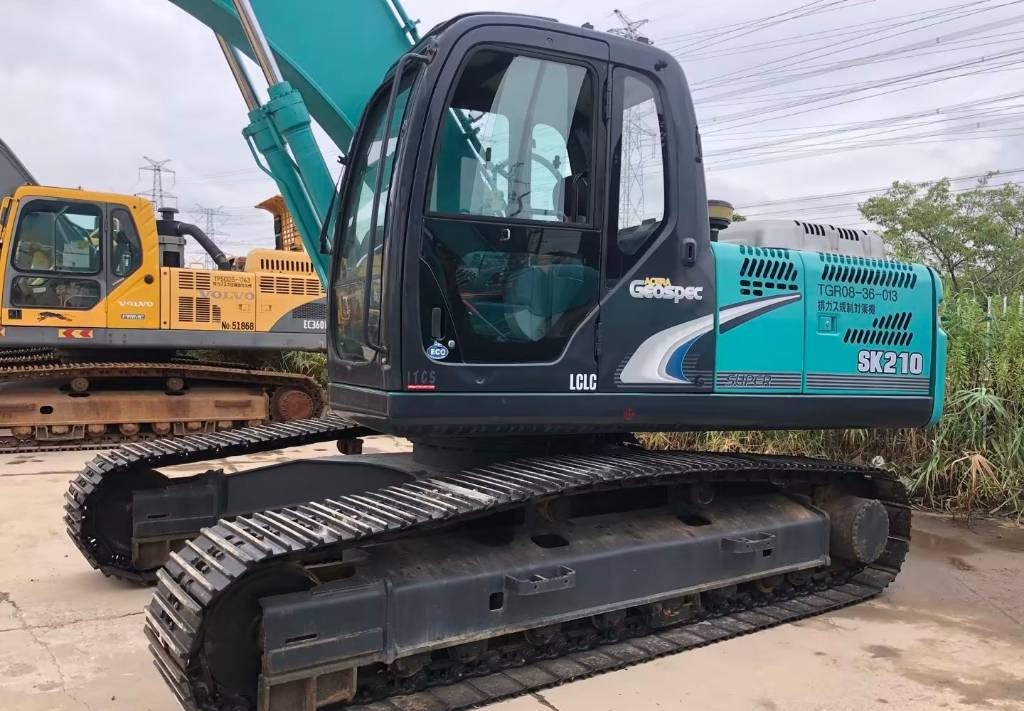 Kobelco SK 210-8 - Ekskavator me zinxhirë: foto 3 Kobelco SK 210-8 - Ekskavator me zinxhirë: foto 3