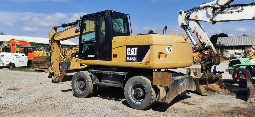 CAT M 315 D - Ekskavator me goma: foto 5 CAT M 315 D - Ekskavator me goma: foto 5