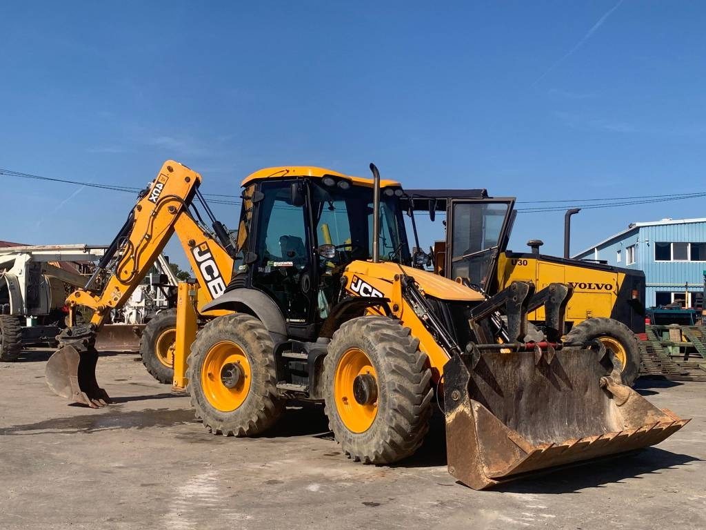 JCB 4 CX - Fadromë me shkarkim nga prapa: foto 1 JCB 4 CX - Fadromë me shkarkim nga prapa: foto 1