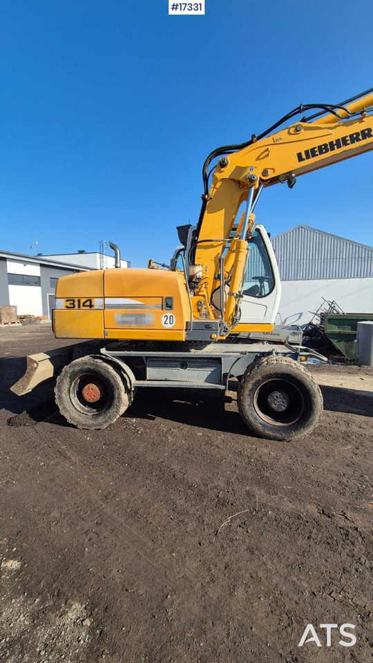 LIEBHERR A314 Litronic Wheel Excavator (2010) - Ekskavator me goma: foto 1 LIEBHERR A314 Litronic Wheel Excavator (2010) - Ekskavator me goma: foto 1